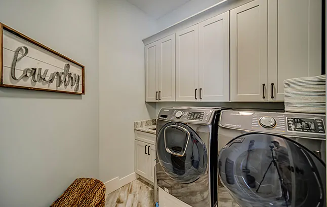 Dove Shaker laundry cabinets.