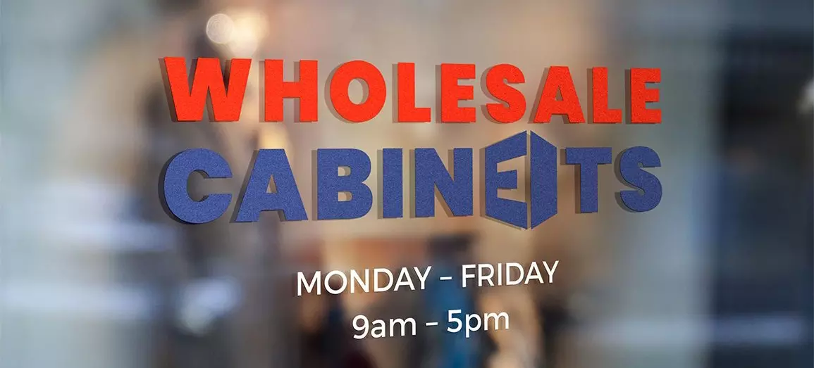 Wholesale Cabinets' headquarters front door with opening hours