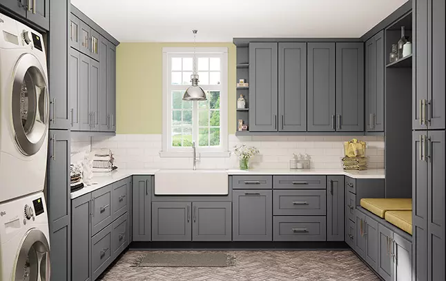 Grey Shaker laundry room cabinets in a U-shaped layout.