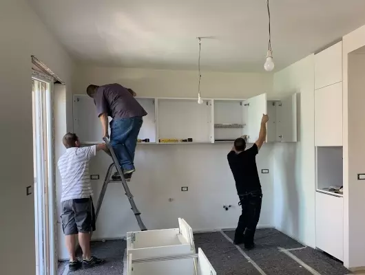 men-installing-wall-cabinets