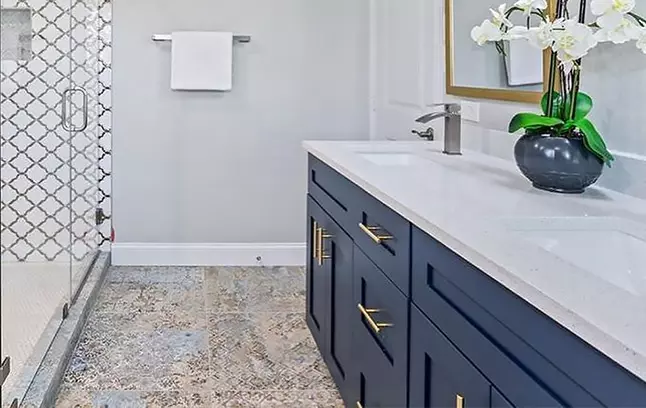 Midnight Blue Shaker vanity cabinets and shower.