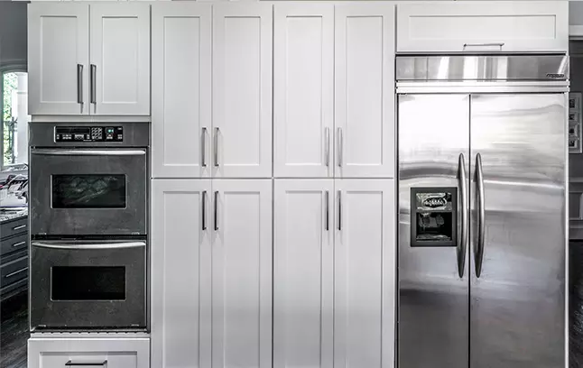 Two, four-door pantry cabinets in our Yorktown White Shaker style.